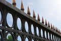 Image of a Beautiful decorative cast iron wrought fence with artistic forging. Metal guardrail close up.