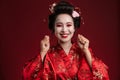 Image of beautiful geisha woman in traditional japanese kimono smiling Royalty Free Stock Photo