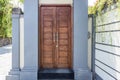 Front door with unique design made from hard wood.