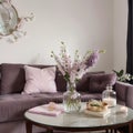 Beautiful lilac flowers on table in living room