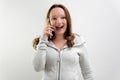 Image of beautiful smiling blonde woman talking on cellphone and laughing, having business call on mobile phone Royalty Free Stock Photo