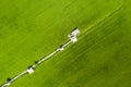 Image of beautiful Terraced rice field in water season and Irrigation from drone,Top view of rices paddy field with wooden bridge