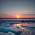 Beautiful winter arctic seascape. The sun sets over the horizon. Ice-covered seashore and unfrozen water. Large ice