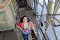 Image of a beautiful woman in a multicolored blouse and blue jeans Royalty Free Stock Photo