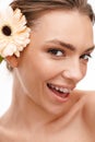 Image of beautiful young happy shirtless woman with gerber flower Royalty Free Stock Photo