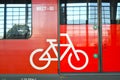 An image of a bicycle on the entrance door to an electric train car. Russian text - 80 seats Royalty Free Stock Photo