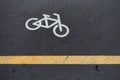 Image of Bicycle sign or icon on the road in the park. Bike path Royalty Free Stock Photo