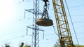 Image of big electric magnet hanging on crane on the dump Royalty Free Stock Photo