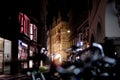 Image with bikes infront out of focus and old archicture building ancient at night