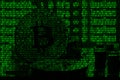 Image of the binary code from bright green digits, through which the image of the physical bitcoin Royalty Free Stock Photo