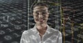 Image of binary coding over caucasian female it engineer with tablet checking computer servers Royalty Free Stock Photo
