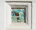 Image of a bird on ceramic tile. Ancient decoration of the ancient orthodox church Royalty Free Stock Photo