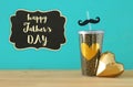 Image of black cup with golden heart. Father`s day concept. Royalty Free Stock Photo