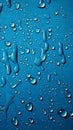 Image Blue background adorned with water drops on textured fabric surface Royalty Free Stock Photo