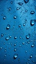 Image Blue background adorned with water drops on textured fabric surface Royalty Free Stock Photo