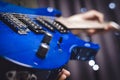 Image of a blue electric guitar close-up. The concept of tuning and repairing musical instruments Royalty Free Stock Photo