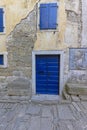 Image of a blue entrance door to a residential building with an antique faÃÂ§ade Royalty Free Stock Photo