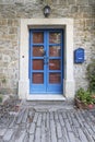 Image of a blue entrance door to a residential building with an antique faÃÂ§ade Royalty Free Stock Photo