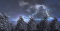 Image of blue glowing shooting star and clouds moving over winter landscape on night sky Royalty Free Stock Photo