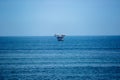 Image of blue ocean in north of Peru. Platform in middle of sea.