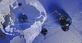 Image of blue particles and network of connections over spinning globe on blue background