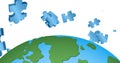 Image of blue puzzle pieces falling over globe on white background Royalty Free Stock Photo