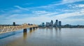 Blue sky over downtown skyscrapers Louisville Ohio River with rose gold bridge Royalty Free Stock Photo