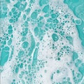 The image is of a blue and white foam with many bubbles Royalty Free Stock Photo