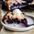 Blueberry cobbler, a slice of tart made with blueberries, close-up