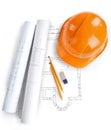 Image of blueprints with level pencil and hard hat on table Royalty Free Stock Photo