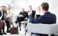 Image is blurred.businessman conducting a meeting