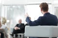 Image is blurred.businessman conducting a meeting
