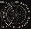 Blurry bicycle wheels on a black background