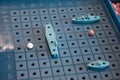 Image board game sea battle with a playing field and plastic figures of ships and marks on the battlefield