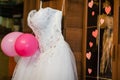 Image of the bodice of a weeding dress on a hanger