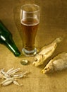 Image of the bottle, a glass of beer and dry fish Royalty Free Stock Photo
