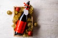 Image of bottle of wine in box with tinsel, Christmas balls Royalty Free Stock Photo