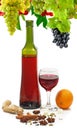 image of a bottle of wine, a glass of wine, grape, orange and spices close-up