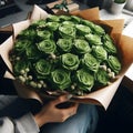 image of a bouquet of many Green roses in wrapping paper.