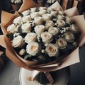 an image bouquet of many white roses in wrapping paper.