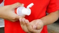 Image of boy`s hand using hand sanitizer Royalty Free Stock Photo