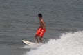 The boy surfer in Lagos popular beach, Tarkwa bay, Lagos Nigeria Royalty Free Stock Photo