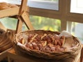 Image of breads, pastries, neatly arranged on baskets and shelves.