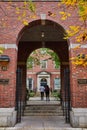 Brick arch leading into law campus in New York City with students