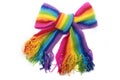 The image of a bright rainbow knitted scarf