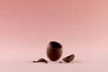 Image of broken chocolate easter egg and copy space on pink background Royalty Free Stock Photo