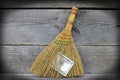 Image of broom with dollars, close-up