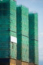Image of a building in progress with security net around it. High building Royalty Free Stock Photo