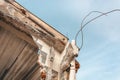 Image of a building under demolition. Concrete, bricks and steel beams.