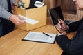 Image of businessman hand holding cardboard box and sending a re